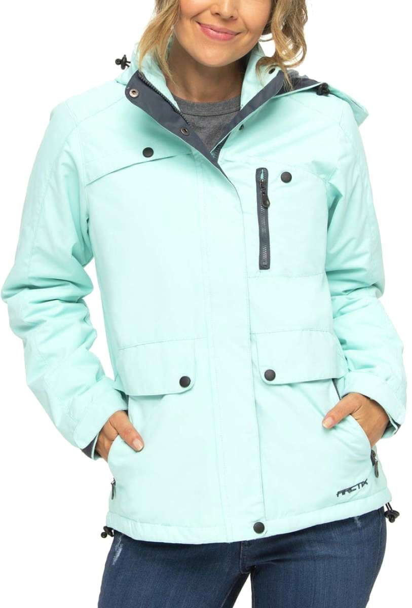 Arctix Women's Daybreak Insulated Jacket 2023 - A light blue jacket with a hood, featuring black zippers and buttons.