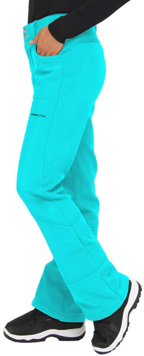 Arctix Ladies Sarah Softshell Pant 2023 - A pair of bright turquoise snow pants with a black logo on the left leg, featuring two pockets and a zippered pocket on the right side.