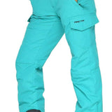 Arctix Women's Snowsports Cargo Pants 2023 - A pair of women's snow sports cargo pants in a solid teal color with two front pockets and one back pocket.
