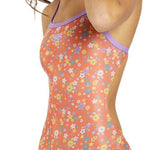 Arena Women's Lydia Jacoby Simone Manuel Challenge Back One Piece Swimsuit - A coral-colored one-piece swimsuit with a floral pattern of white, yellow, and blue flowers.