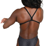 Arena Women's Lydia Jacoby Simone Manuel Challenge Back One Piece Swimsuit - Black swimsuit with a geometric pattern of light blue and dark blue shapes on the torso, straps, and sides.