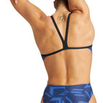 Arena Women's Puzzled Challenge Back One Piece Swimsuit - A blue one-piece swimsuit with a geometric pattern of light and dark blue lines on a darker blue background.