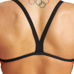 Arena Women's Puzzled Challenge Back One Piece Swimsuit - A one-piece swimsuit with a colorful, abstract pattern of shapes and lines in shades of blue, green, yellow, orange, and red.