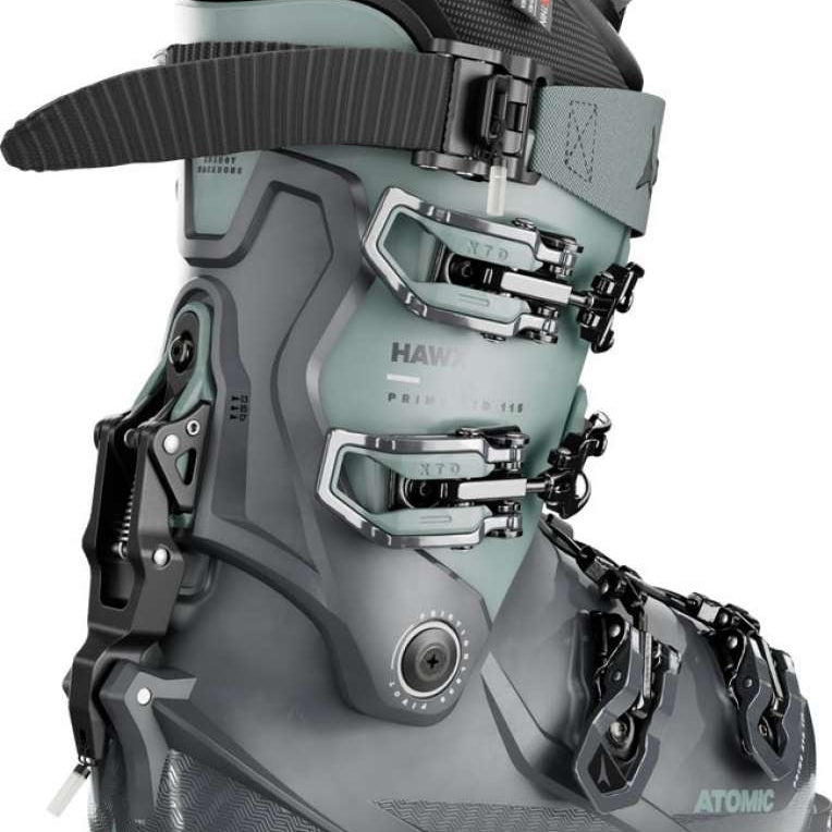 Atomic Women's Hawx Prime XTD 115 Ski Boots 2024 - A pair of women's ski boots with a light teal-green color and silver buckles.