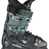 Atomic Women's Hawx Ultra 95 S Ski Boots 2023-2024 - A pair of women's ski boots with a teal-green upper and black soles, featuring silver buckles.