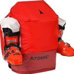 Atomic RS 30L Backpack - A red backpack with a zippered front pocket and two side pockets, featuring black buckles and straps.