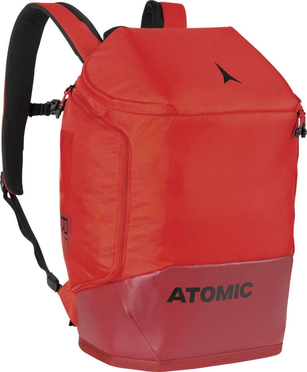 Atomic RS 30L Backpack - A red backpack with a zippered front pocket and two black zipper pulls on either side of the top.