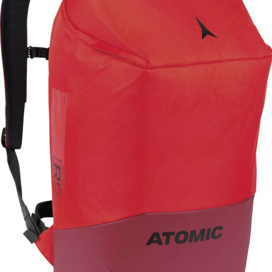 Atomic RS 50L Backpack - A red backpack with a black strap and zipper, featuring a zippered pocket on the front.