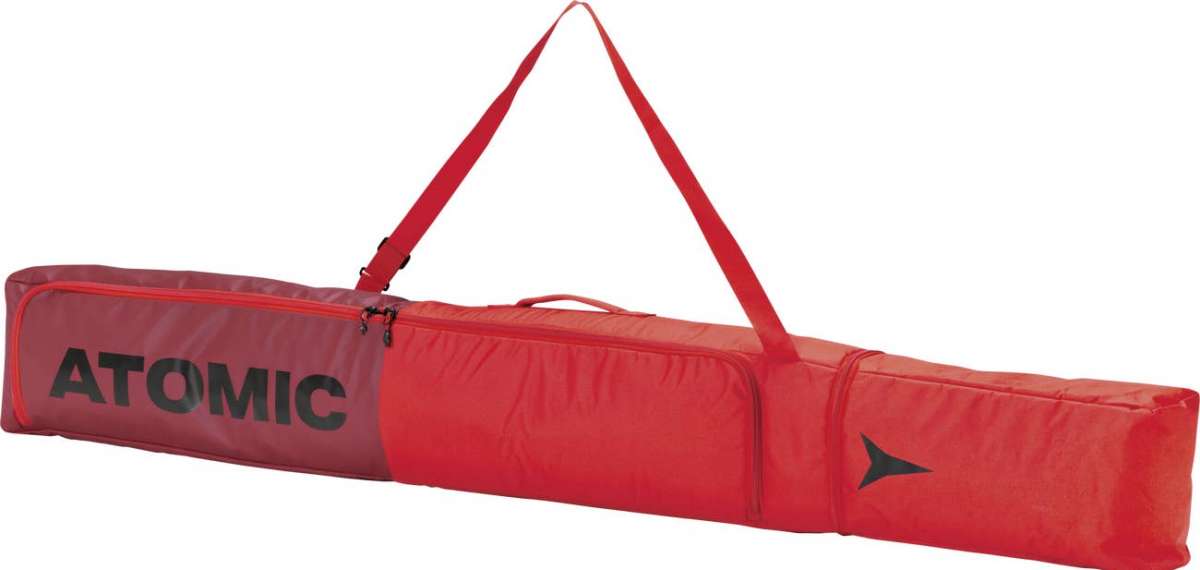 Atomic Ski Bag 2022-2023 - A red ski bag with a zipper and handle, featuring the word "ATOMIC" in black on one side.