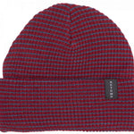 Autumn Stripe Beanie 2023 - A red beanie with blue stripes and a black label that says "AUTUMN" in white letters.