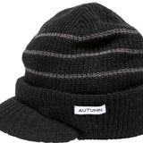 Autumn Visor Beanie 2022-2023 - A black beanie with a visor and horizontal stripes.