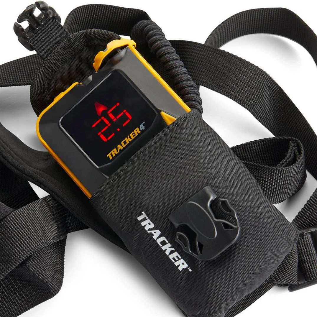 BCA T4 Rescue Package 2024 - A black avalanche beacon with a red screen and yellow trim, lying on its side next to a matching shovel and probe.