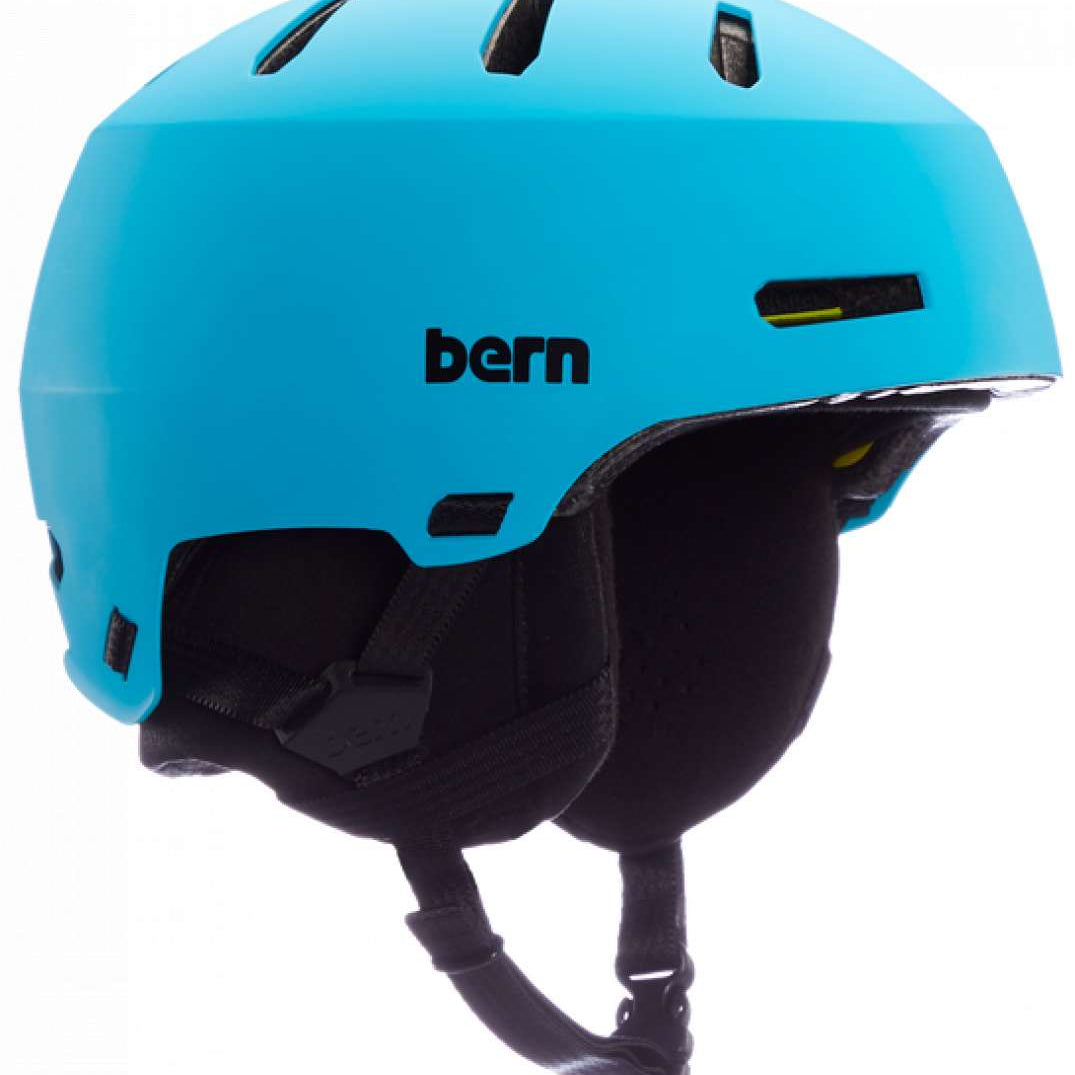 Bern Junior's Macon 2.0 MIPS Helmet 2024 - A matte black helmet with a white logo on the front and a yellow strap in the back.