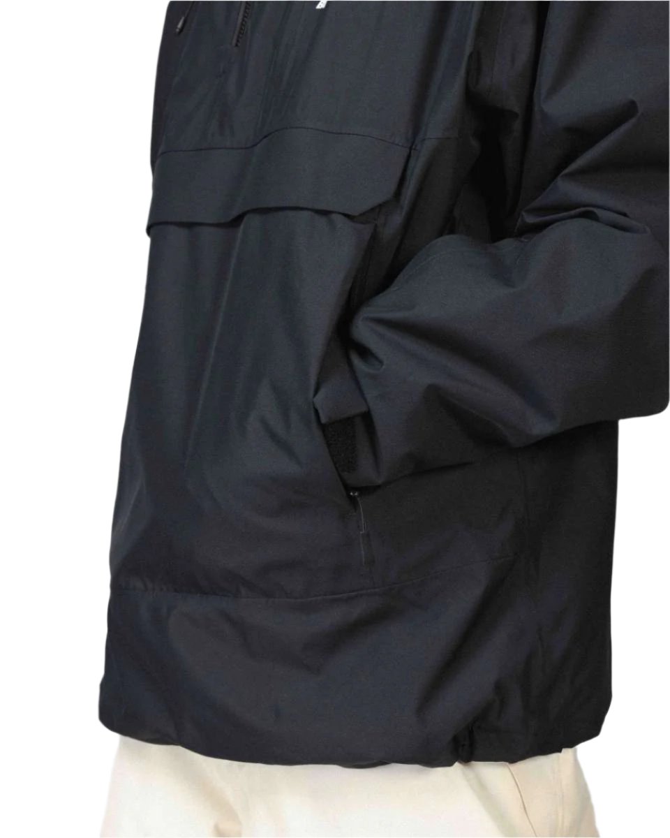 Beyond Medals Anorak 2L Shell Jacket 2024 - A black jacket with a zippered chest pocket and adjustable cuffs.