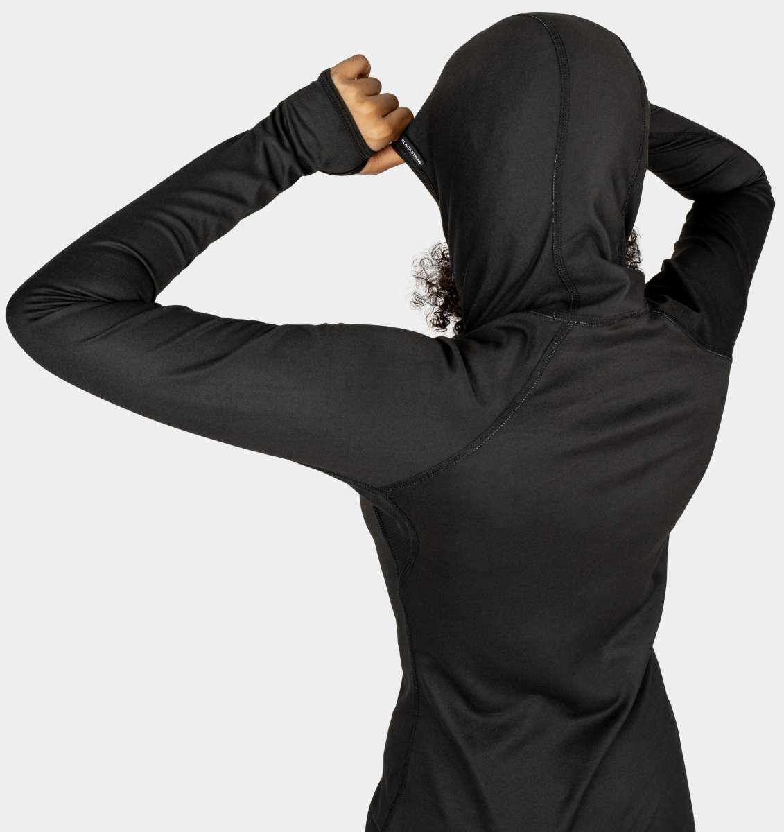 BlackStrap Women's Cloudchaser Hoodie 2024 - A black hoodie with a hood and drawstrings, featuring a zipper down the front.