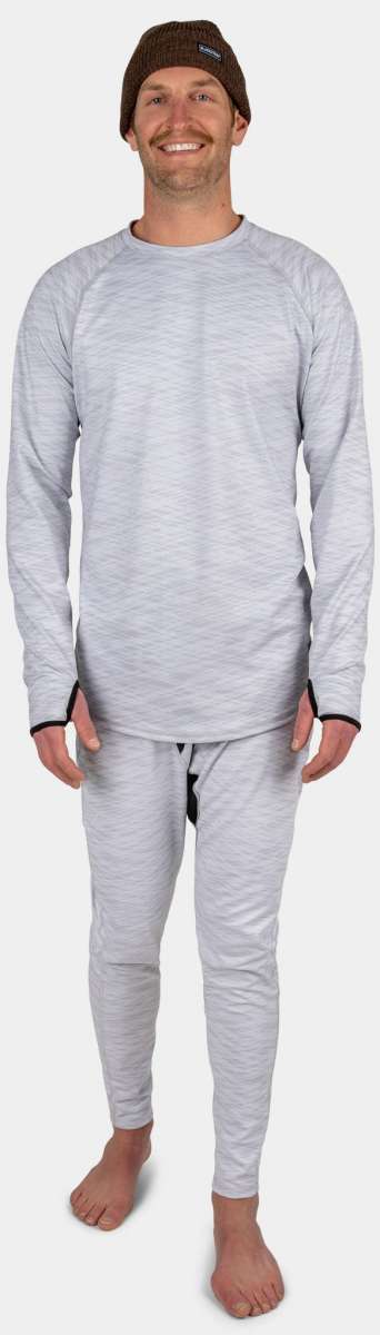 BlackStrap Summit Bottom Baselayer - A man wearing a black baselayer with a crew neck and long sleeves, paired with matching black pants featuring an elastic waistband.