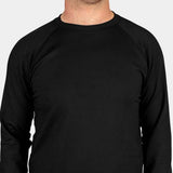 BlackStrap Summit Crew Top Baselayer 2024 - A black crew-neck shirt with raglan sleeves and a tag on the left sleeve.