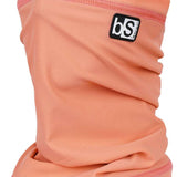 BlackStrap The Tube Solid Dual Layer 2024 - A peach-colored neck gaiter with a black logo patch on the upper right side.