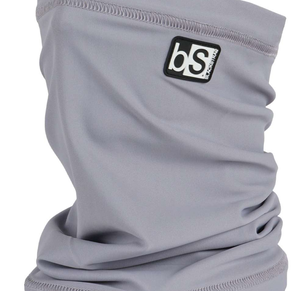 BlackStrap The Tube Solid Dual Layer 2024 - A solid gray neck gaiter with a black logo patch on the upper right side.