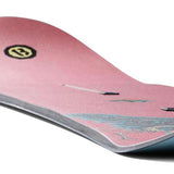 Burton 1995 Kelly Air 2024 - A pink snowboard with a black logo featuring a white "B" and a yellow circle around it.