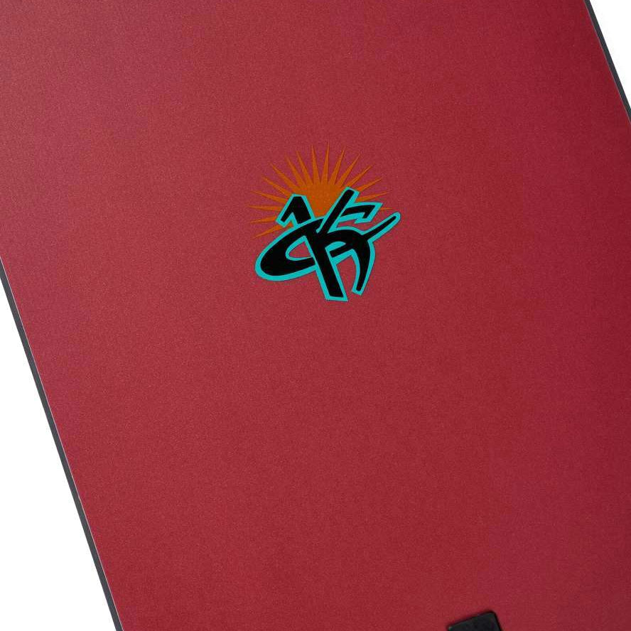 Burton 1995 Kelly Air 2024 - A red snowboard with a black and white logo featuring a sunburst design in the center.