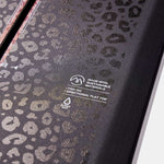 Burton Fish 3D Snowboard 2023 - A black snowboard with a leopard print design and red accents on the edges.