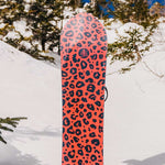 Burton Fish 3D Snowboard 2023 - A snowboard with a leopard print design on an orange background.