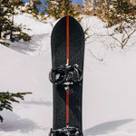 Burton Fish 3D Snowboard 2023 - A black snowboard with a leopard print design and red stripe down the middle.
