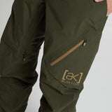 Burton AK GORE-TEX Cyclic Pant 2023 - Dark green pants with a zippered pocket on the thigh and a small star-shaped zipper pull.