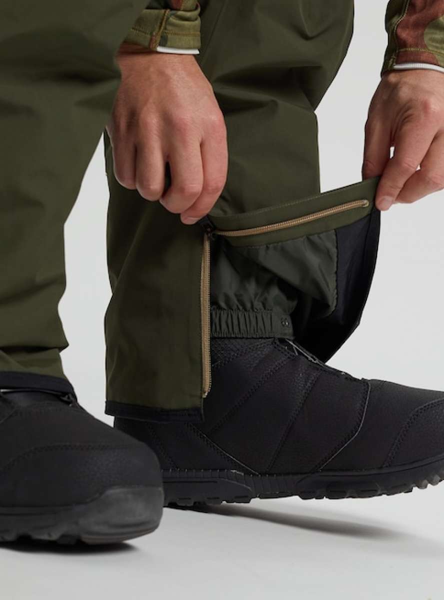 Burton AK GORE-TEX Cyclic Pant 2023 - Dark green waterproof pants with a zippered ankle cuff and elastic waistband.