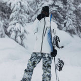 Burton AK GORE-TEX Cyclic Pant 2023 - Black snow pants with a subtle pattern of thin, light gray lines and small, dark gray dots.