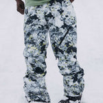 Burton AK GORE-TEX Cyclic Pant 2023 - Black snow pants with a subtle yellow pattern and black accents, featuring a zippered pocket on the right thigh.
