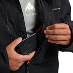 Burton Frostner 2L Jacket 2024 - A black jacket with a white logo on the chest and a zipper running down the middle.