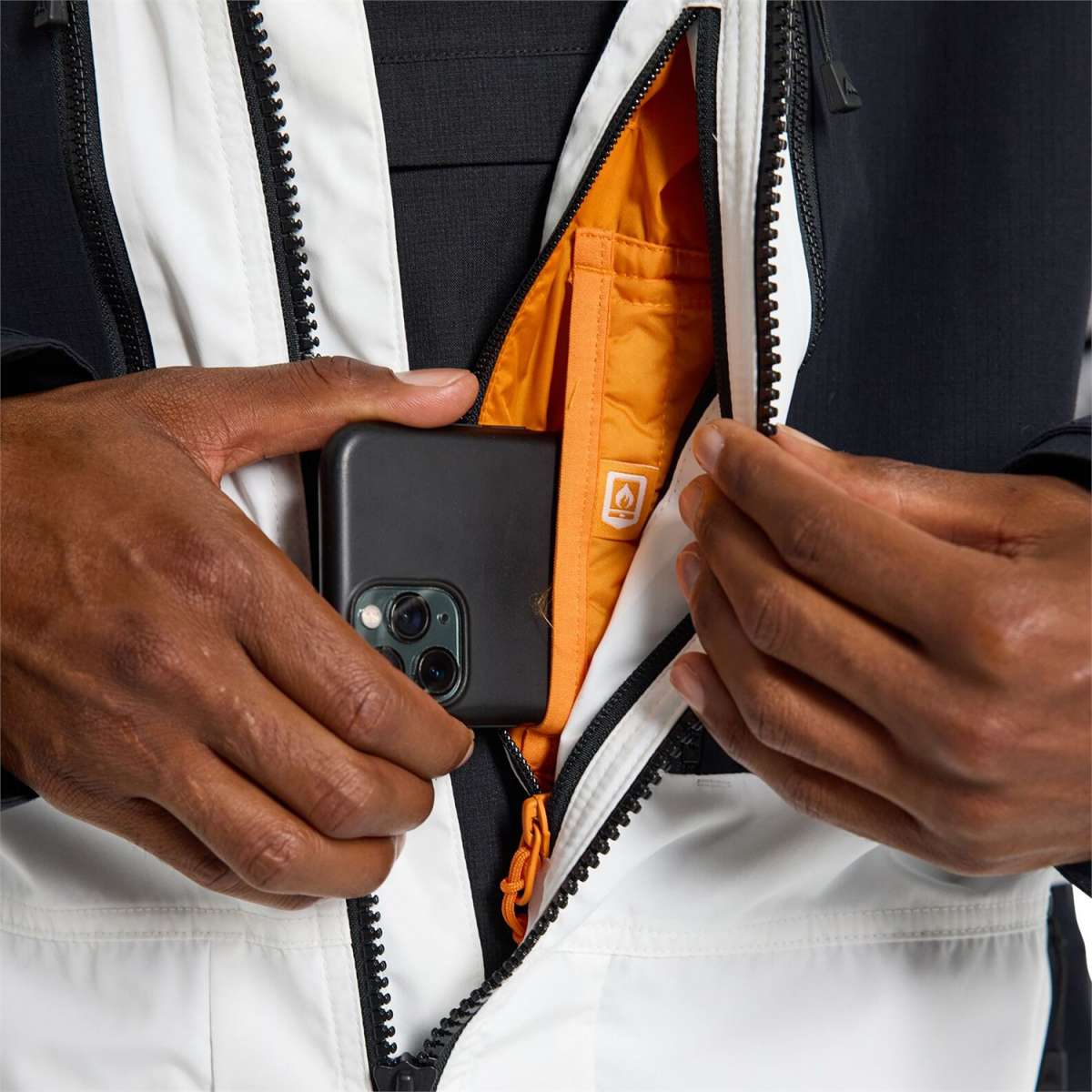 Burton Frostner 2L Jacket 2024 - A black jacket with a white stripe on the left sleeve and a zipper down the front.