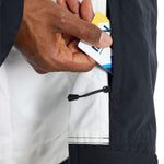 Burton Frostner 2L Jacket 2024 - A white jacket with a black stripe on the sleeve and a blue logo on the chest.