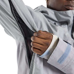 Burton Frostner 2L Jacket 2024 - A light gray jacket with a black zipper and two zippered pockets on the front.