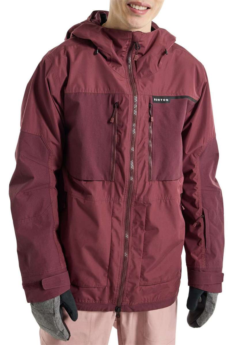 Burton Frostner 2L Jacket 2024 - A maroon-colored jacket with a hood and multiple zippered pockets.