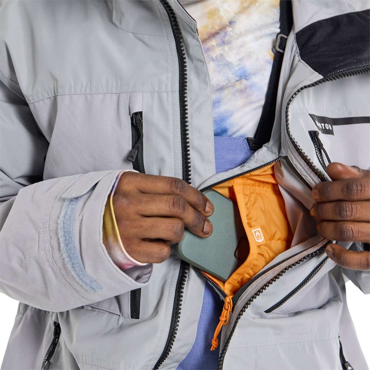 Burton Frostner 2L Jacket 2024 - A light gray jacket with a black zipper and logo on the chest.