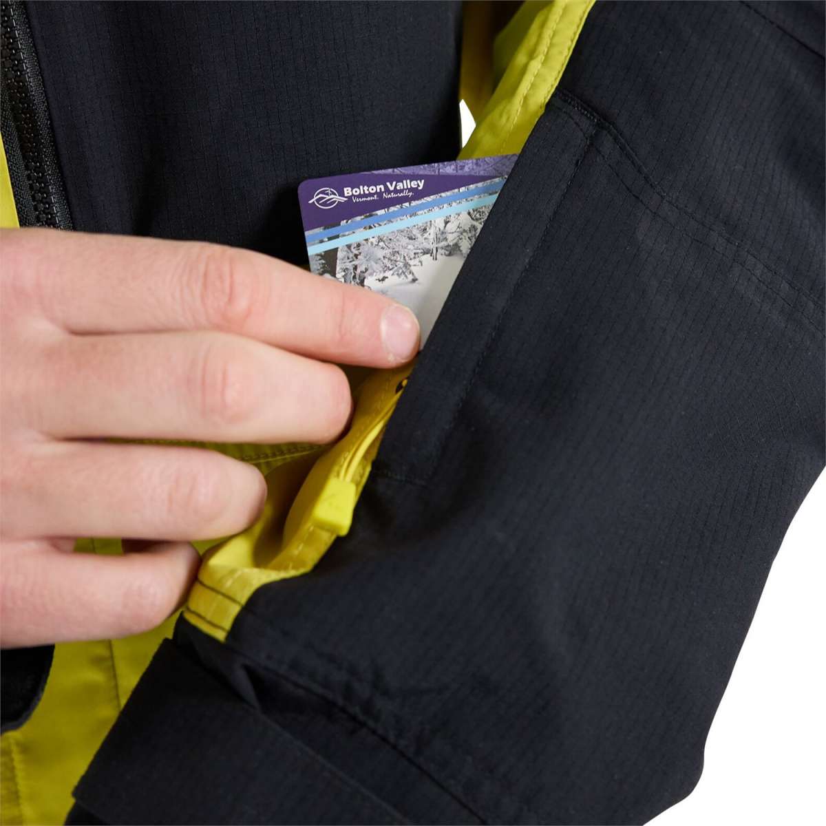 Burton Frostner 2L Jacket 2024 - A black jacket with a white logo on the left chest and yellow accents around the zipper.