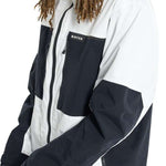 Burton Frostner 2L Jacket 2024 - A black and white jacket with a zippered chest pocket featuring the word "BURTON" in white letters.