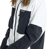 Burton Frostner 2L Jacket 2024 - A black and white jacket with a zippered chest pocket featuring the word "BURTON" in white letters.