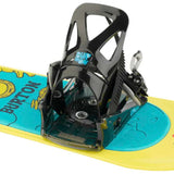 Burton Junior's Grom Disc Snowboard Binding 2024 - A black binding with a blue logo on top, mounted on a yellow snowboard.