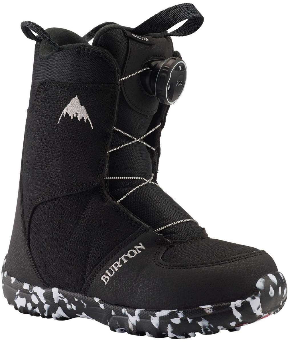 Burton Junior's Grom BOA Snowboard Boot 2024 - Black snowboard boots with white stitching and a small, round black dial on the side.