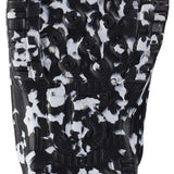 Burton Junior's Grom BOA Snowboard Boot 2024 - Black snowboard boots with a white pattern and red accents on the back.