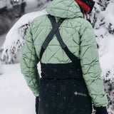 Burton Women's AK Gore-Tex Kimmy Bib Pant 2023 - A black bib pant with a white logo on the left leg and adjustable straps over the shoulders.