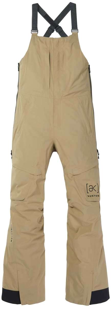 Burton Women's AK Gore-Tex Kimmy Bib Pant 2023 - A pair of khaki-colored snow pants with a black logo on the left leg and adjustable straps at the shoulders.