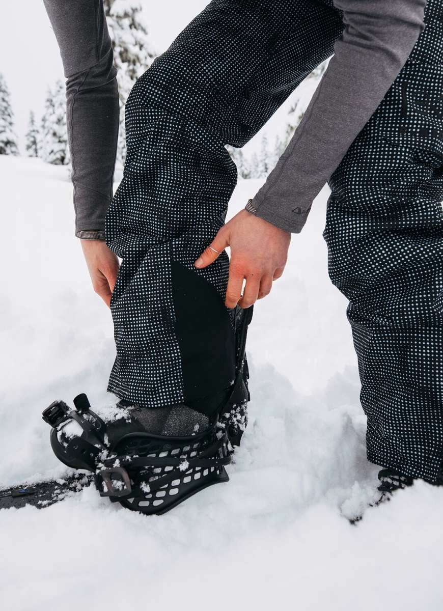 Burton Women's AK Gore-Tex Kimmy Bib Pant 2023 - Black bib pant with white dots and a black zipper on the side.