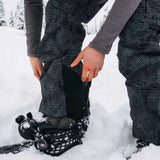 Burton Women's AK Gore-Tex Kimmy Bib Pant 2023 - Black bib pant with white dots and a black zipper on the side.