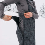 Burton Women's AK Gore-Tex Kimmy Bib Pant 2023 - Black bib with white dots and a black strap over the right shoulder.