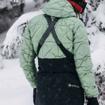 Burton Women's AK Gore-Tex Kimmy Bib Pant 2023 - Black bib pant with white logo on left leg and adjustable straps over shoulders.